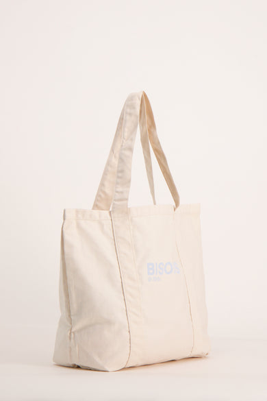 Sac à bandoulière beige de OPUS avec des coutures renforcées et des anses de même couleur.
