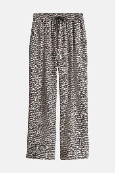 Pantalon brun d'OPUS avec un motif moucheté crème et une ceinture à cordon.