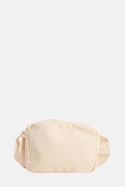 Beige handtas van OPUS, met een toon-op-toon schouderriem, op een effen achtergrond.