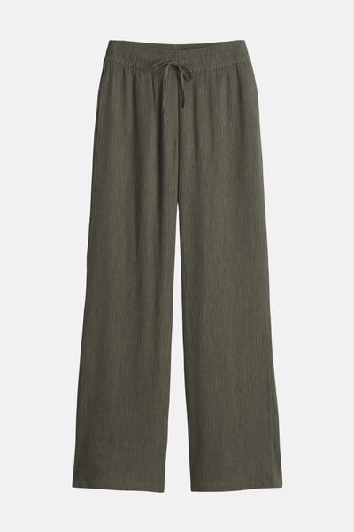 Pantalon vert texturé par OPUS, avec taille élastique et cordon de serrage.