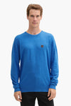 Ronde hals trui blauw van Tom Tailor met een klein logo op de borst.