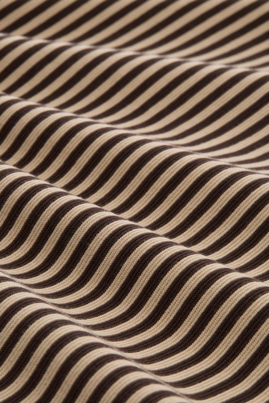Multicolored ribbed sweatshirt with brown and beige horizontal stripes, close-up texture view