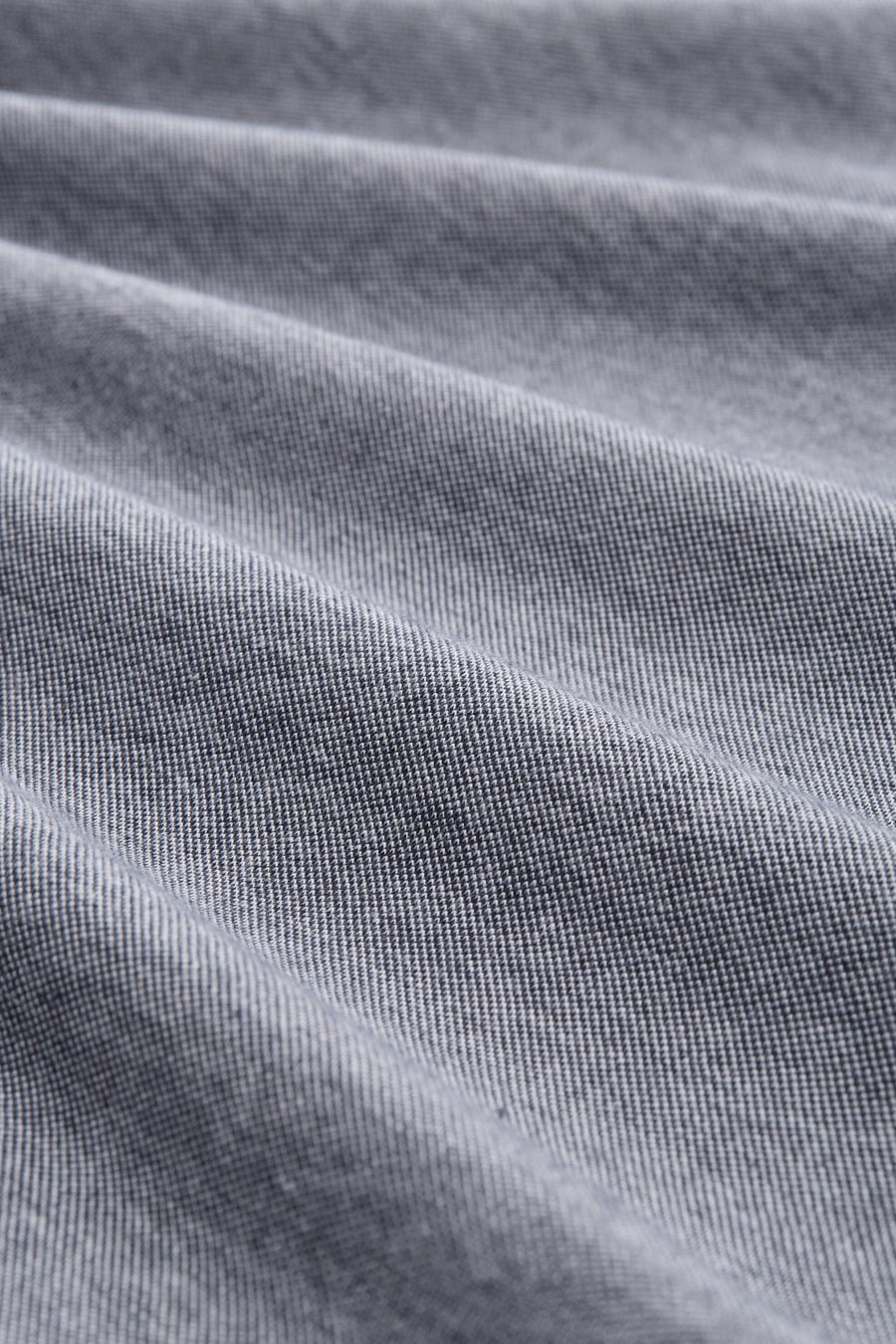 Blauwe polo met korte mouwen van Tom Tailor, in getextureerde stof met lichte plooien.