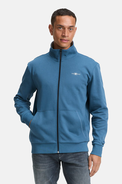 Turquoise Tom Tailor gilet met zwarte ritssluiting en voorzakken.
