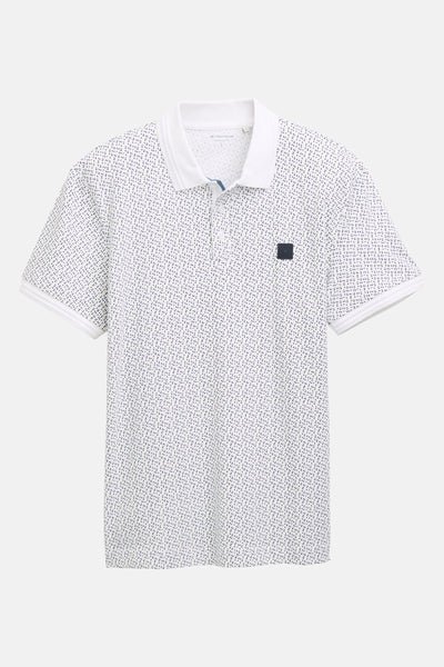 Polo blanc à motif de points par Tom Tailor, avec col et bordures des manches blancs.