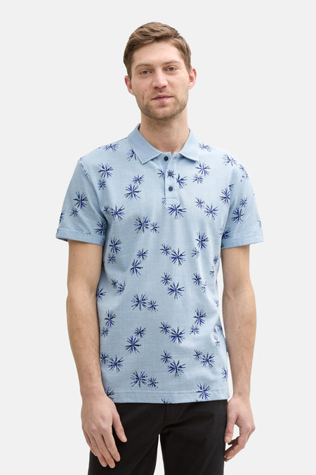 Blauw poloshirt met korte mouwen van Tom Tailor, donkerblauw bloemenpatroon op een getextureerde stof.