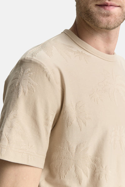 T-shirt à manches courtes beige de Tom Tailor avec motif discret de palmiers en relief.