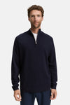 Pull à col rond bleu de Tom Tailor, avec fermeture éclair argentée et un t-shirt blanc visible.