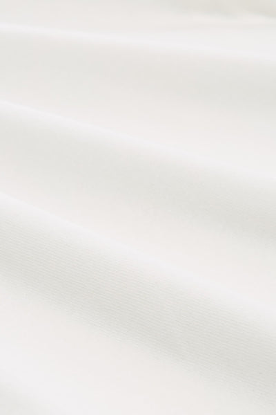 T-shirt à manches longues blanc de Tom Tailor, texture de tissu côtelé fin.