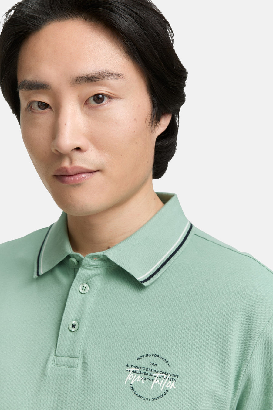 Groen poloshirt met korte mouwen van Tom Tailor, met opdruk van het logo rechtsonder.