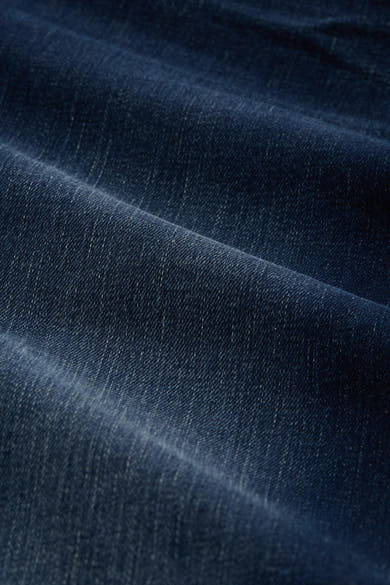 Jean droit en denim bleu foncé par Tom Tailor, avec une texture plissée.