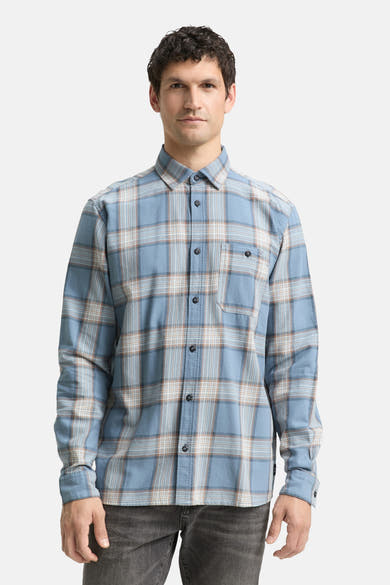 Chemise à manches longues bleue de Tom Tailor, à carreaux avec poche poitrine sur fond uni.