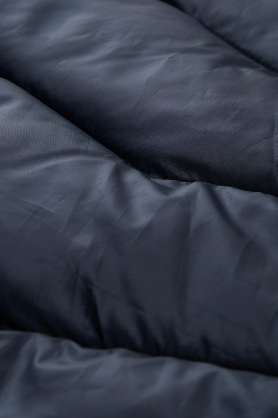 Veste sans manches bleue de Tom Tailor, texture matelassée et rembourrée.