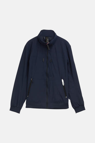 Veste courte bleue de Tom Tailor, avec fermeture éclair, poches zippées et poignets côtelés.