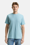 Blauw T-shirt met korte mouwen van Tom Tailor, wafelstructuur, gedragen met een spijkerbroek, achtergezicht.