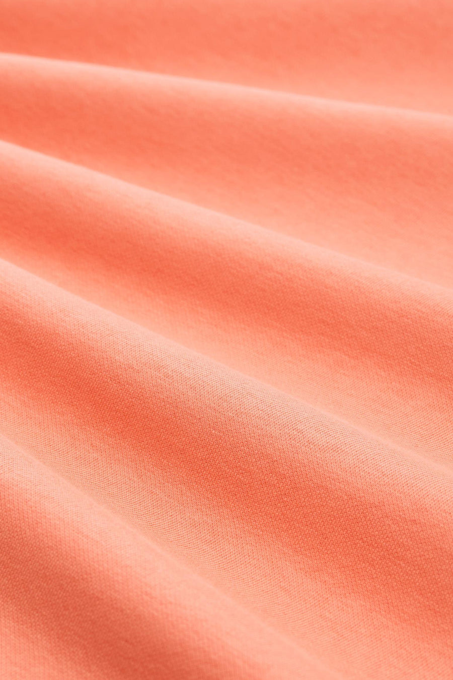 Sweat-shirt corail de Tom Tailor, en tissu texturé avec des plis horizontaux.