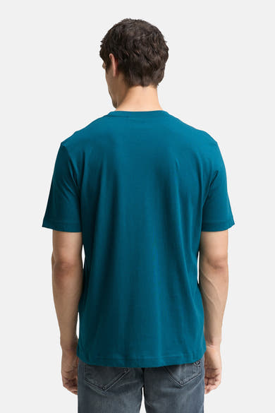 T-shirt à manches courtes turquoise de Tom Tailor, vue de dos, porté avec un jean gris.