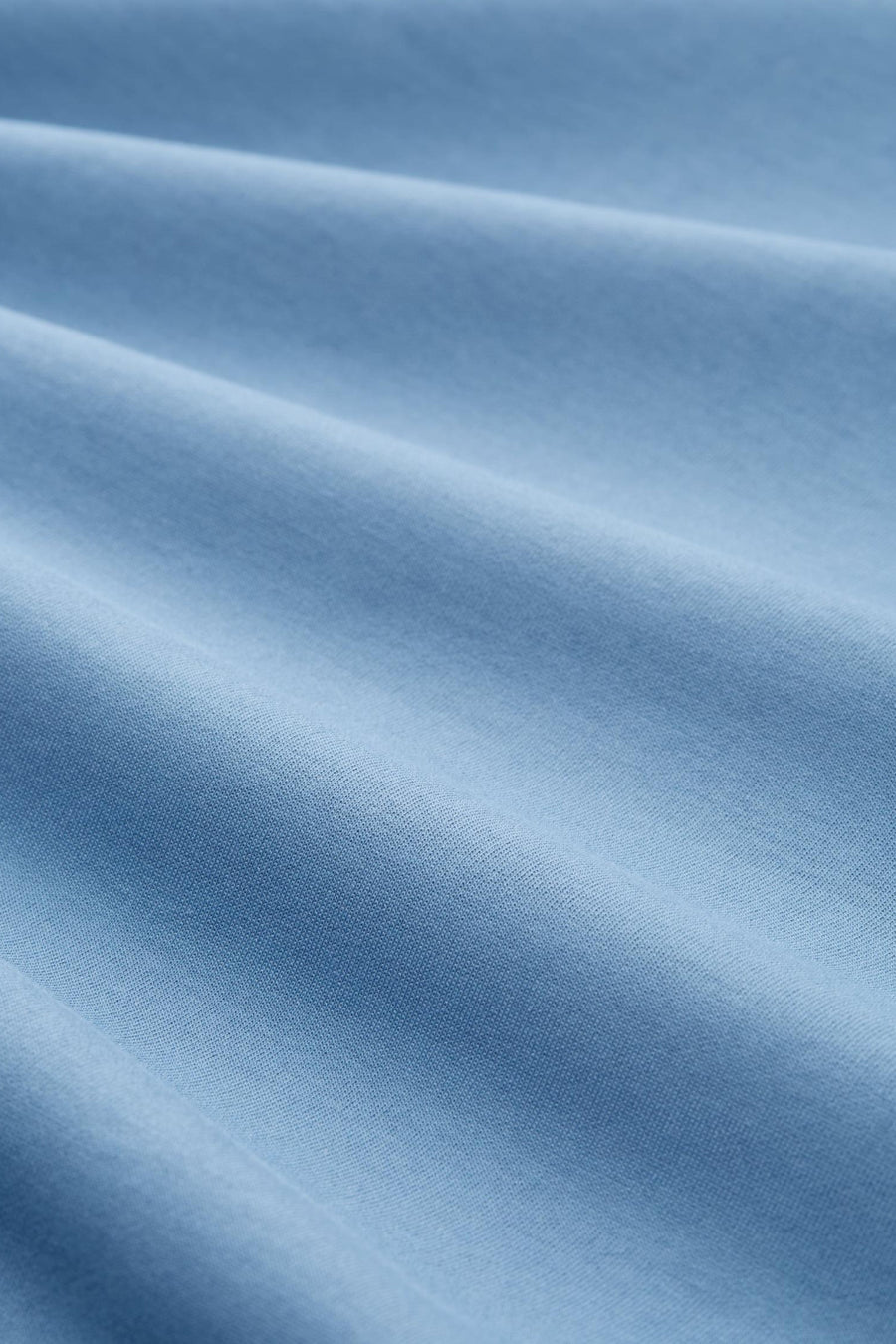 Blauwe sweater van Tom Tailor, getextureerde stof met een subtiel plooipatroon.