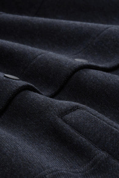 Blazer bleu en tissu texturé par Tom Tailor, avec boutons discrets et pli élégant.