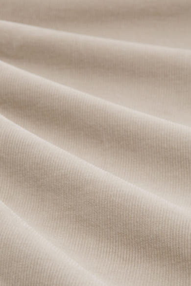 Beige corduroy trousers by Tom Tailor, with soft pleats and a rich texture.