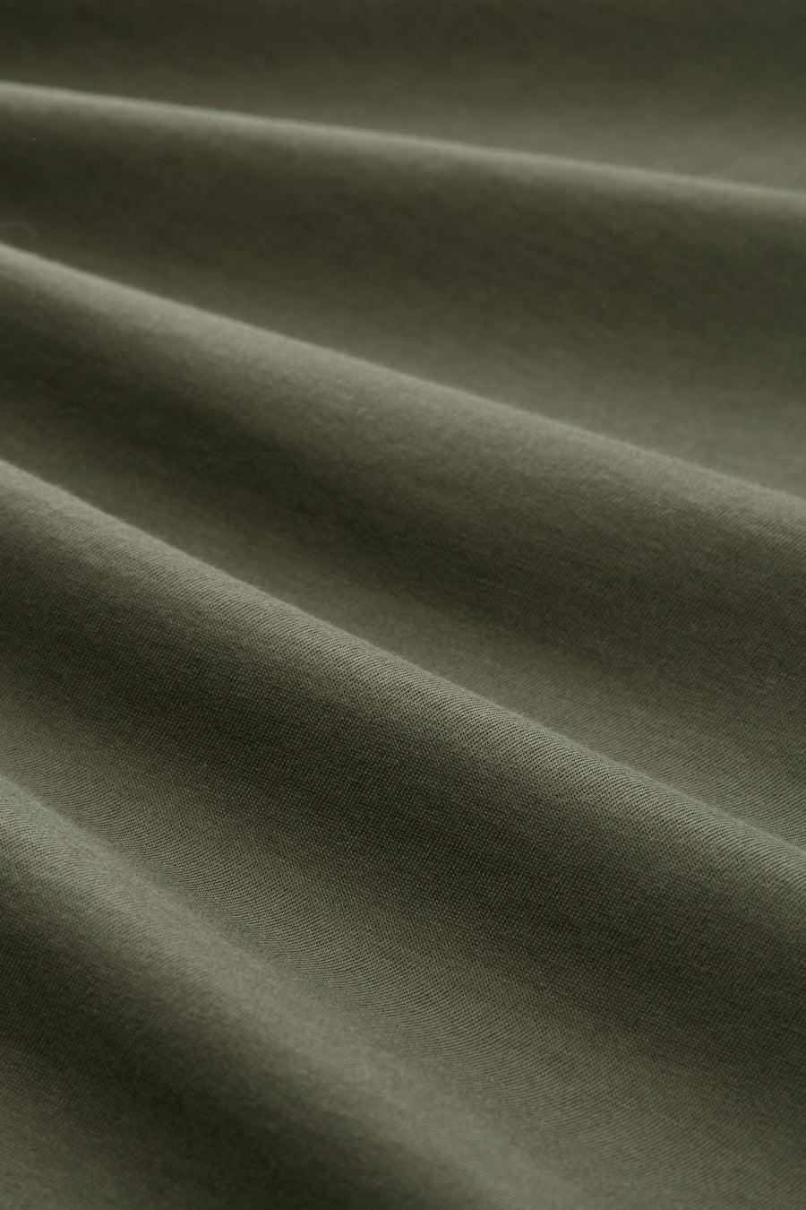 T-shirt vert de Tom Tailor, en tissu doux plissé avec une texture subtile.