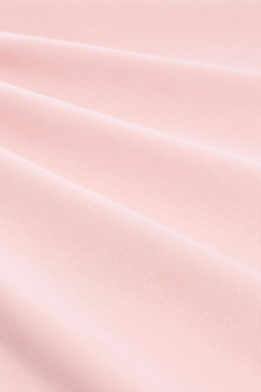 Polo rose de Tom Tailor en tissu tricoté doux avec des plis subtils.