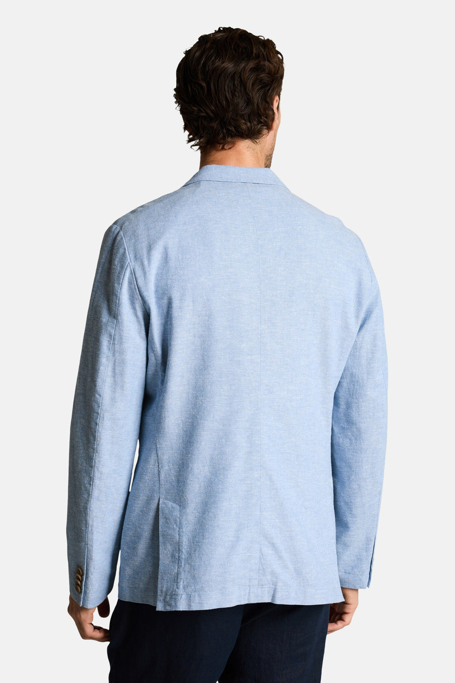 Blazer bleu de Tom Tailor en tissu texturé, vu de dos avec une fente arrière et des boutons aux manches.