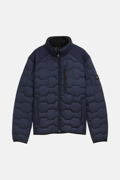 Veste courte bleu marine de Tom Tailor avec motif matelassé hexagonal et empiècements texturés.
