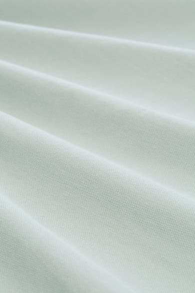 Polo vert pâle de Tom Tailor, en tissu piqué texturé avec des plis doux.