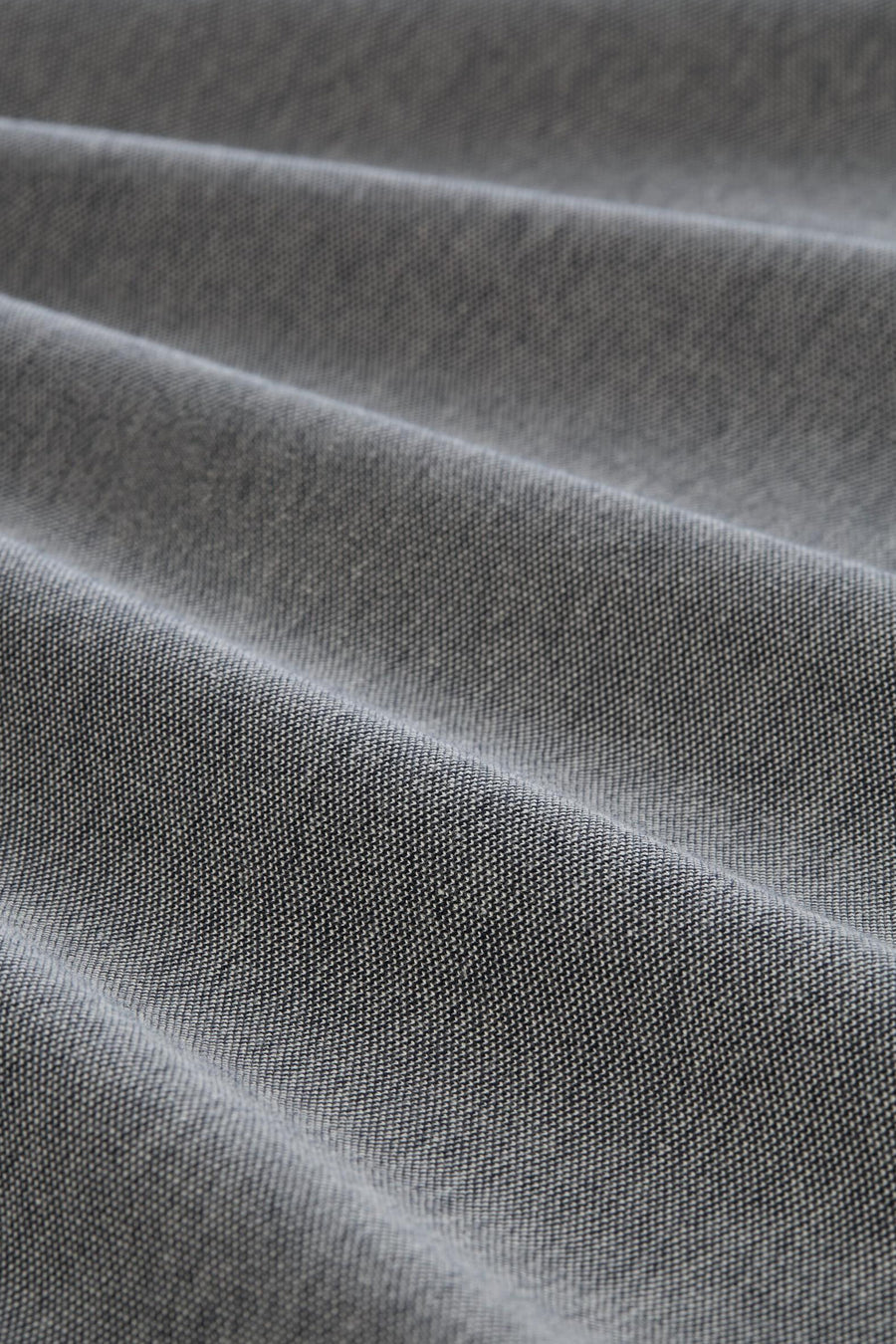 Polo gris en tissu piqué de Tom Tailor avec des plis doux.