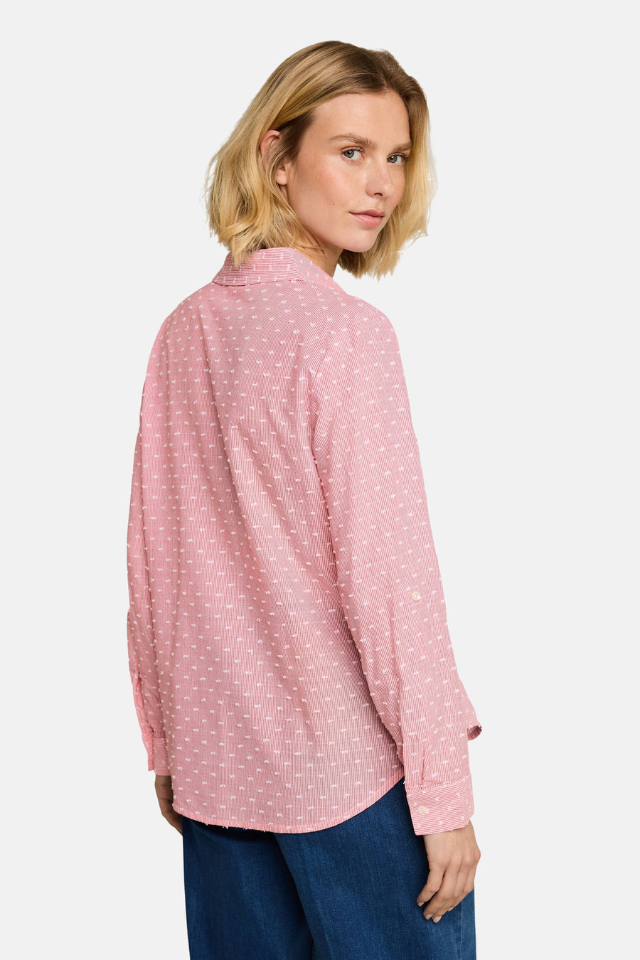 Pink long-sleeve blouse with white geometric print by Tom Tailor, shown from back view on model wearing blue jeans