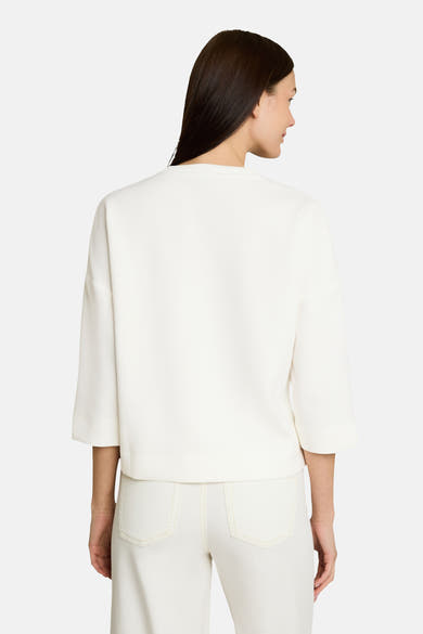 White crewneck sweatshirt with three-quarter sleeves and relaxed fit, back view, paired with matching white pants