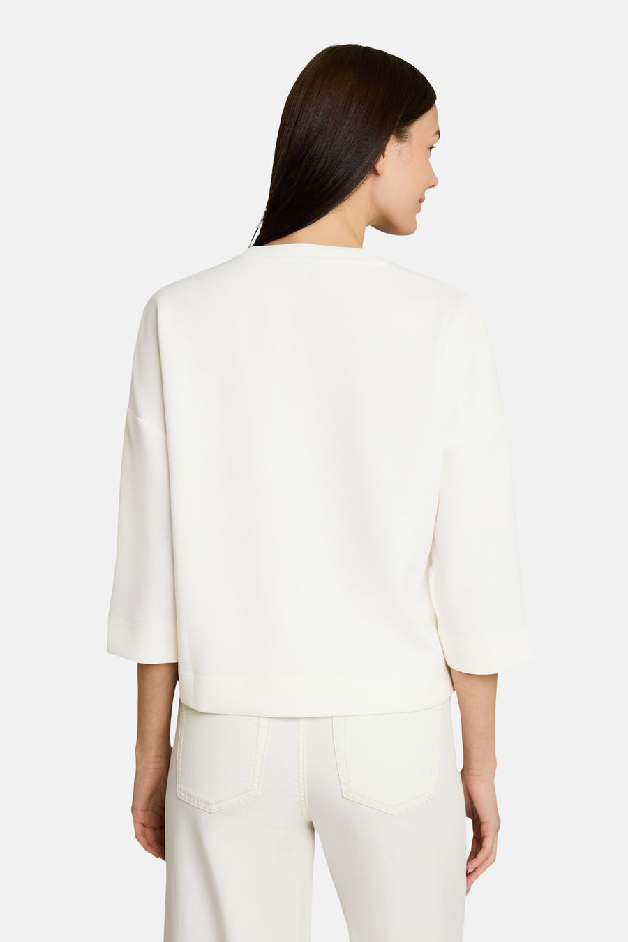 White crewneck sweatshirt with three-quarter sleeves and relaxed fit, back view, paired with matching white pants