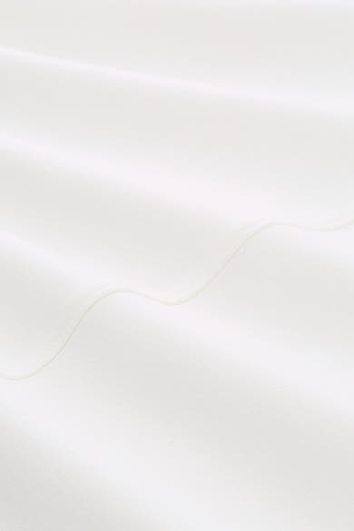 White crewneck sweatshirt fabric close-up, soft textured material with visible stitching detail