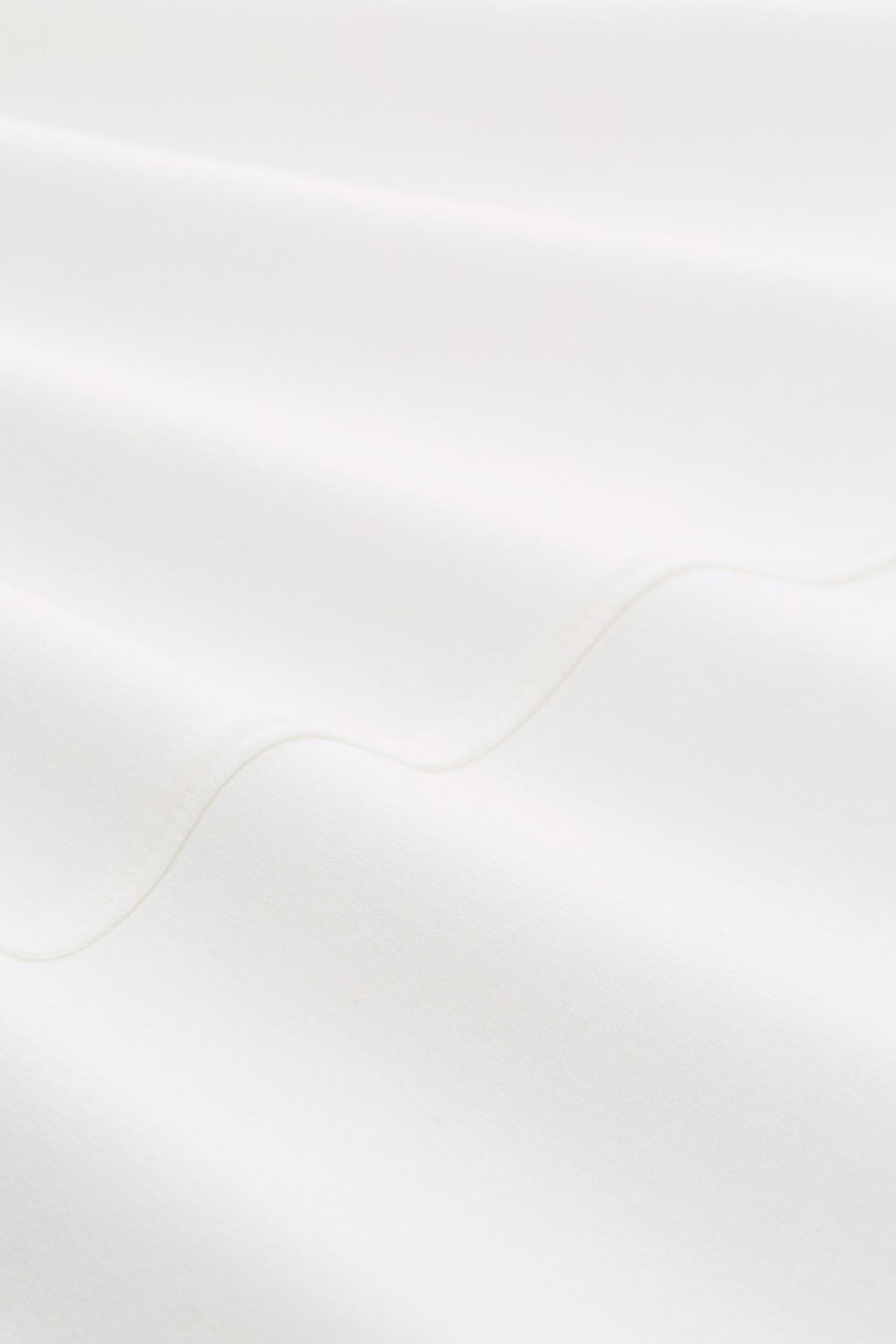 White crewneck sweatshirt fabric close-up, soft textured material with visible stitching detail