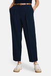 Navy blue tailored trousers by Tom Tailor, featuring front pleats, straight-leg cut, and cropped hem, worn with brown belt and white sneakers.