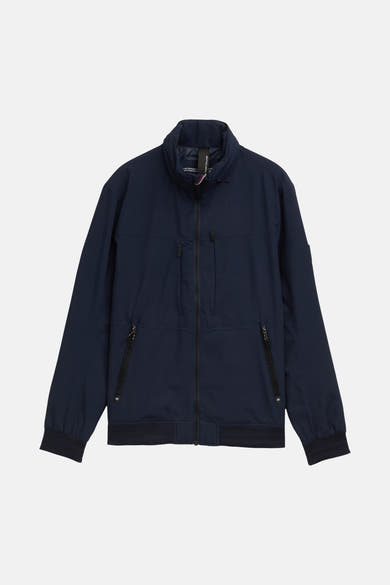 Korte blauwe jas van Tom Tailor, met centrale ritssluiting en zakken met rits.