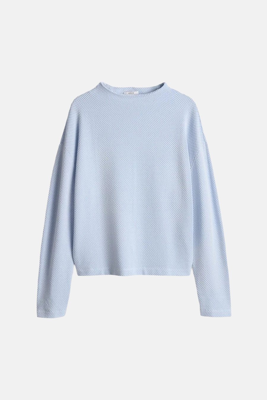 Top uni manches longues bleu d'OPUS, avec texture gaufrée sur toute la surface.