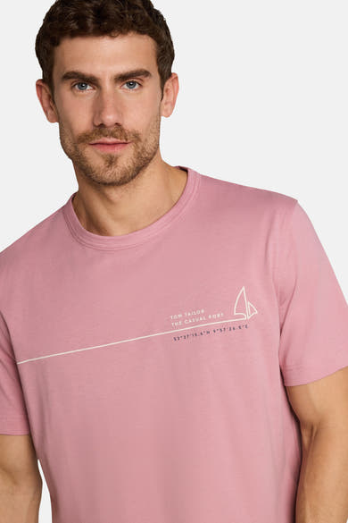 Rose short-sleeve t-shirt by Tom Tailor with white sailboat graphic and diagonal text line, front view on model