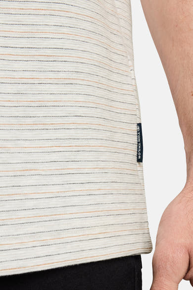 White short-sleeve T-shirt with thin horizontal stripes by Tom Tailor, side view showing ribbed texture and brand tag on seam