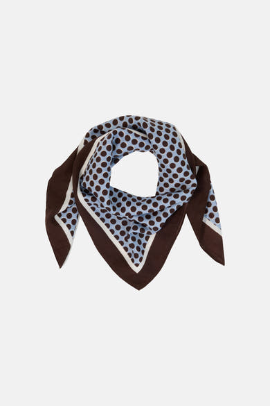 Multicolored polka dot square scarf by Tom Tailor, light blue base with brown dots and bordered edges, folded in loop style