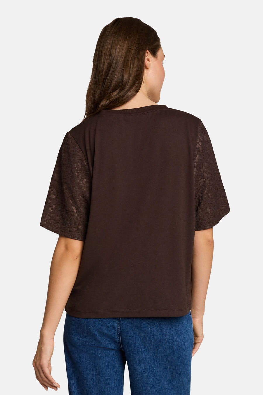 Brown short-sleeve T-shirt with lace sleeves, back view, worn with blue jeans