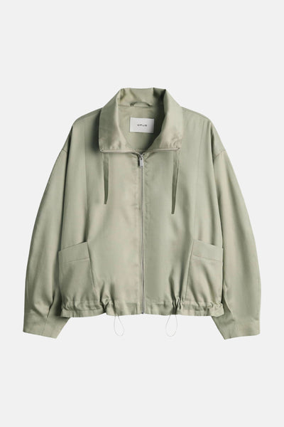 Veste courte vert clair de OPUS, avec fermeture éclair et poches plaquées.