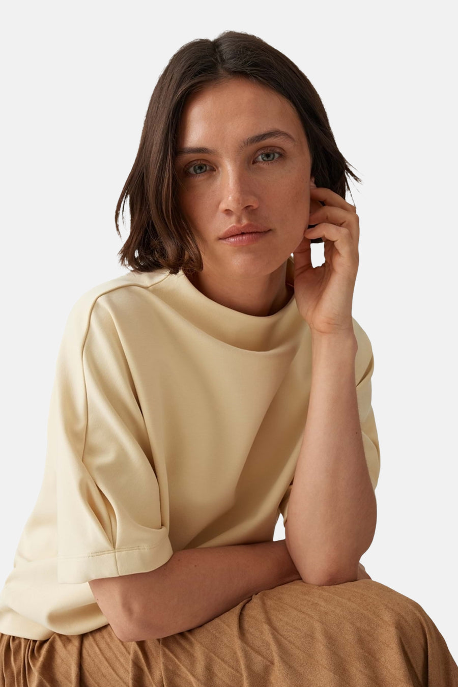 Yellow round-neck sweatshirt by OPUS, soft smooth fabric, relaxed fit, model seated in lifestyle pose