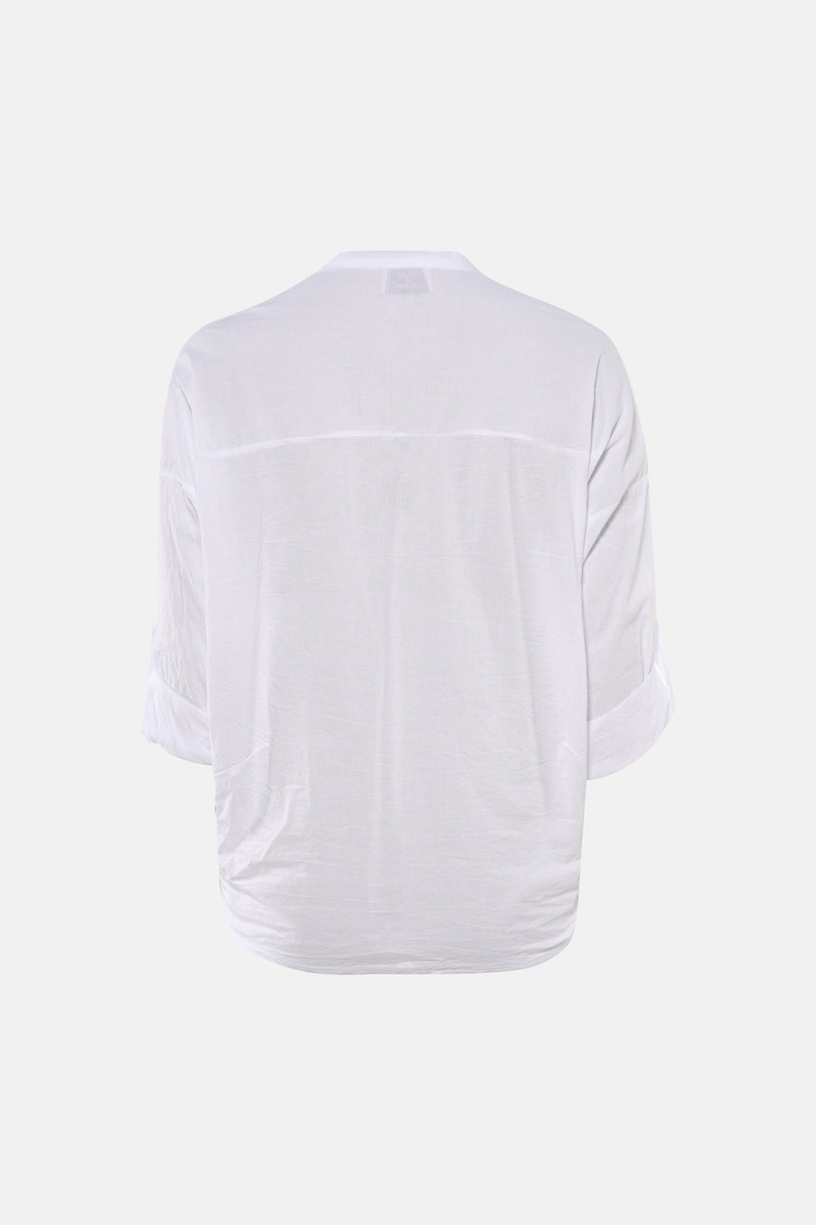 Blouse blanche à manches longues de Terra di Siena, avec ourlet retroussé et coupe ample.