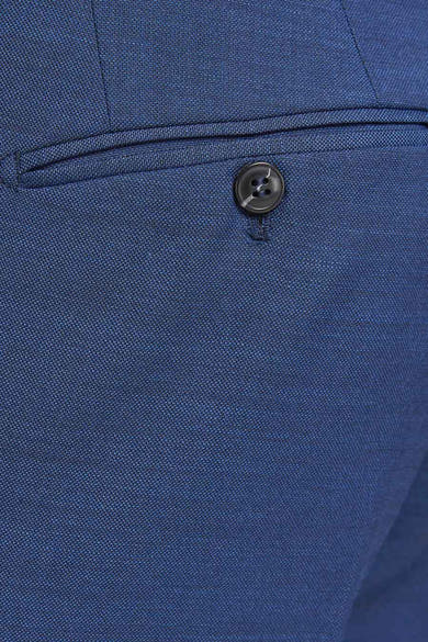 Blauwe blazer van PREMIUM by JACK & JONES, met knoopzak en subtiele textuur van de stof.