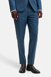 Blue tailored suit pants by JACK & JONES, slim fit with clean front crease, worn with matching blazer and dark brown leather boots, front view.