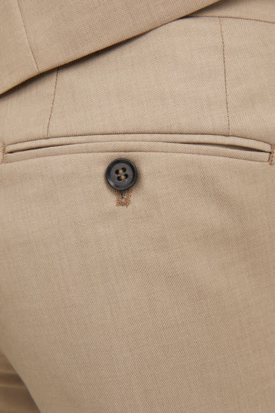 Pantalon de costume beige par PREMIUM BY JACK & JONES avec poche boutonnée à l'arrière.