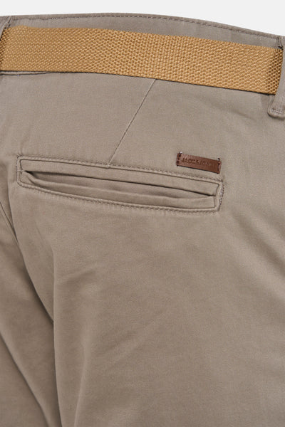 Grey men's chino shorts by Jack & Jones, back view with tan waistband and leather brand patch on pocket.