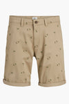 Beige bermuda van JACK & JONES JEANS INTELLIGENCE met donkergroen palmboompatroon.